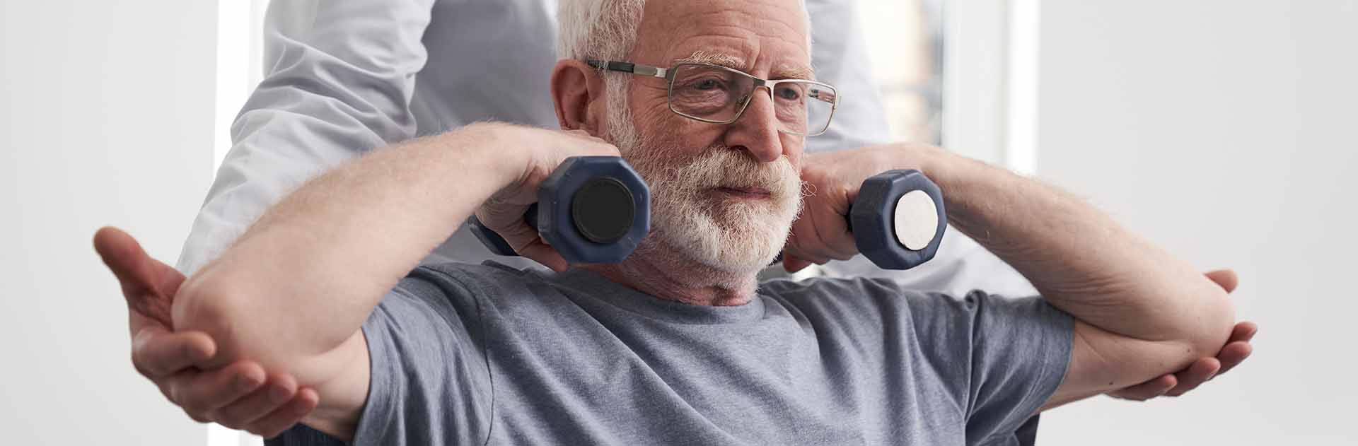 Phyical Therapist with patient in exercise session