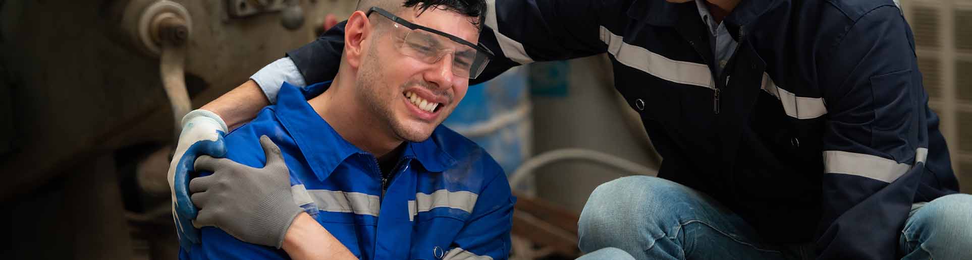 worker holding his shoulder after accident